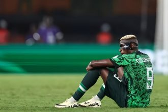 Victor Osimhen sitting on the peach after Super Eagles loss